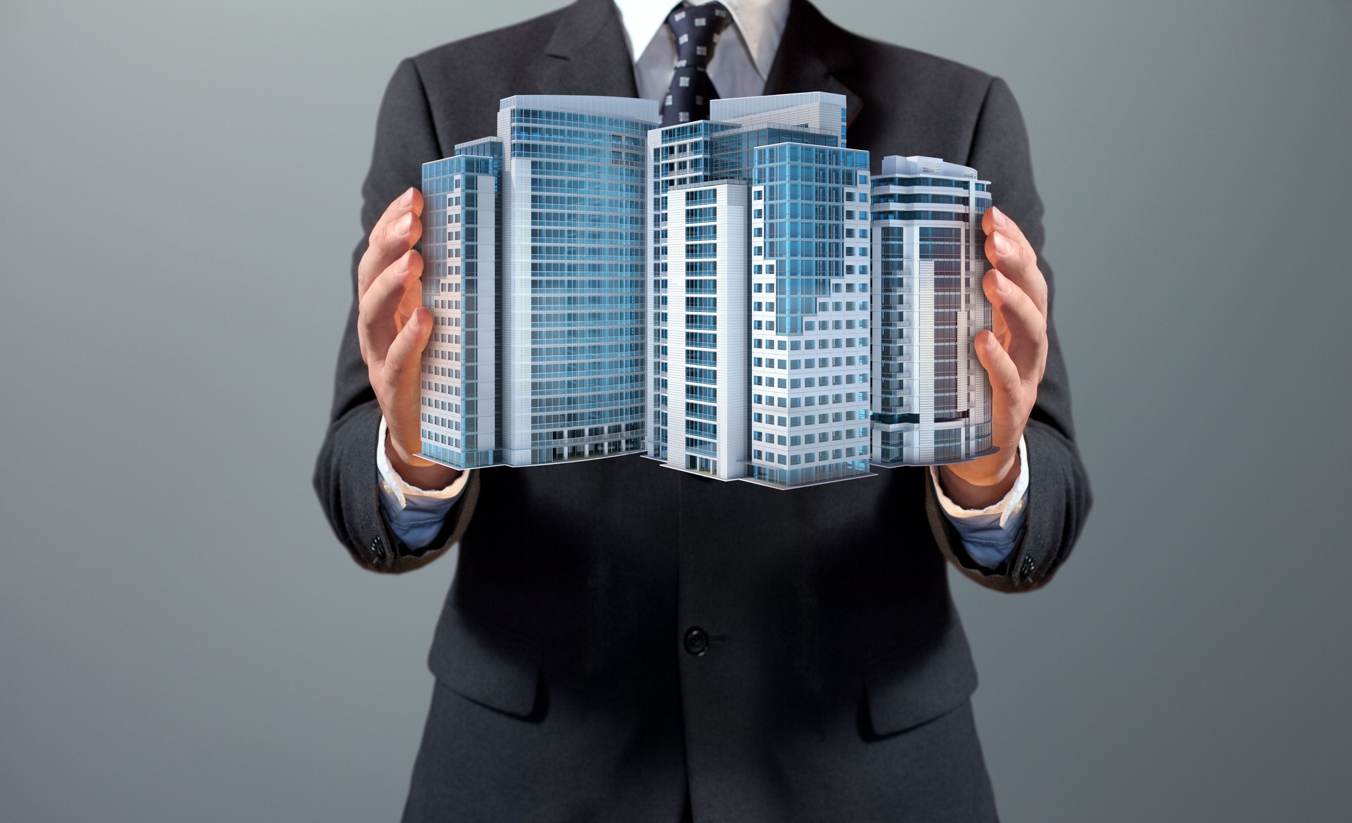 Real estate agent showing modern office buildings for sale